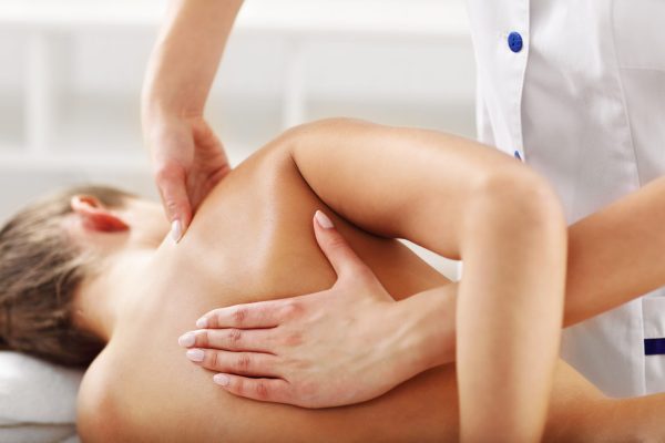 A picture of woman having professional back therapy