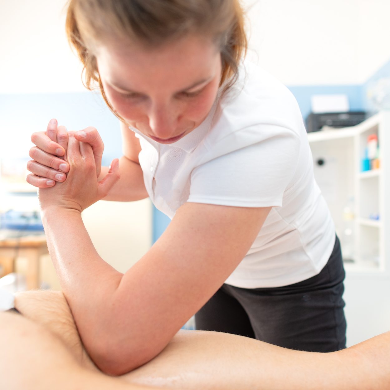 Physiotherapist performs deep and de-contracting drainage
