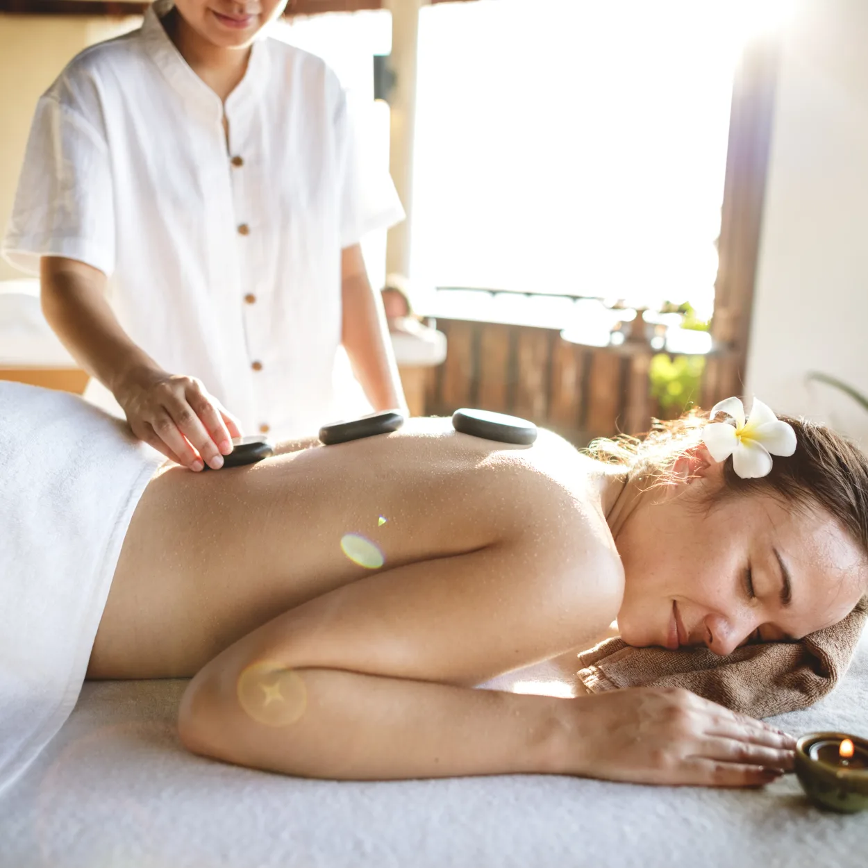Woman getting a hot stone massage