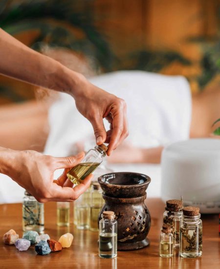 Ayurveda Aromatherapy Massage, Pouring Aromatic Oil in Essential Oil Diffuser Ayurveda Aromatherapy Massage, Pouring Aromatic Oil in Essential Oil Diffuser